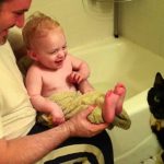 This Cat Is Hungry For Baby Toes!